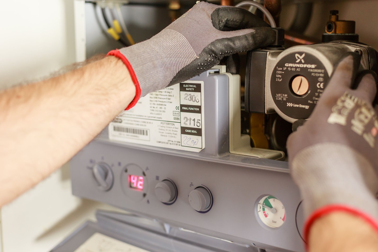 HVAC technician servicing a residential heating and cooling system